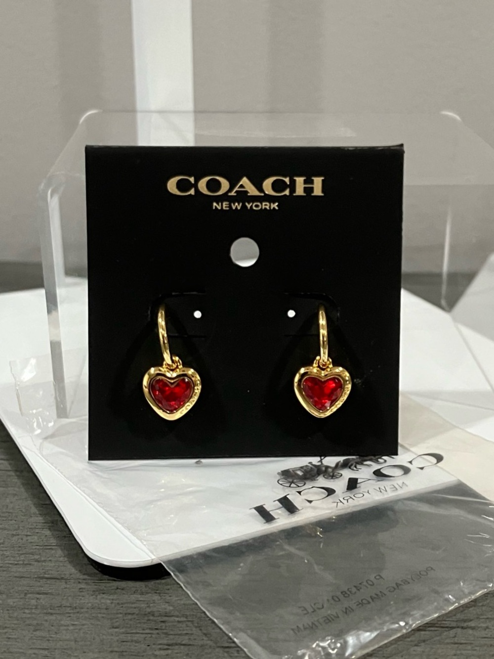COACH Gold Tone Heart Drop Earrings with Red Stones